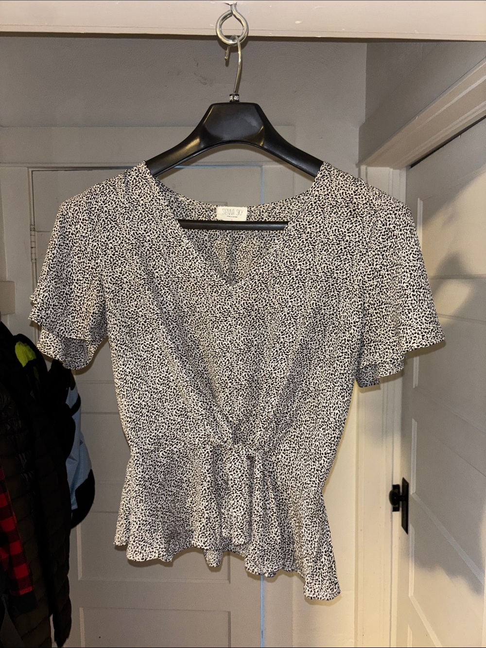 Sienna Sky Black and White Dotted Peplum V-Neck Blouse